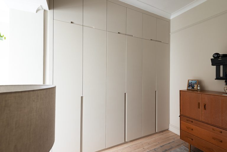 Built-in modern wardrobe with 6 doors in bedroom