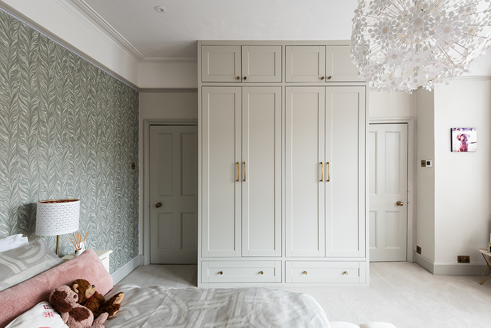 Fitted 4 door modern wardrobe. Designed and installed by carpenters at Bespoke Carpentry London.