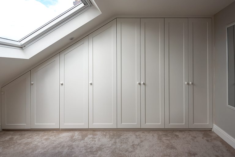 Slanted loft wardrobe with 8 doors, made with MDF
