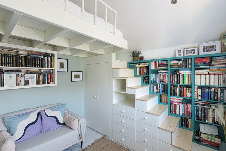 Built in cabin bed with bed, bookshelf, and wardrobe.