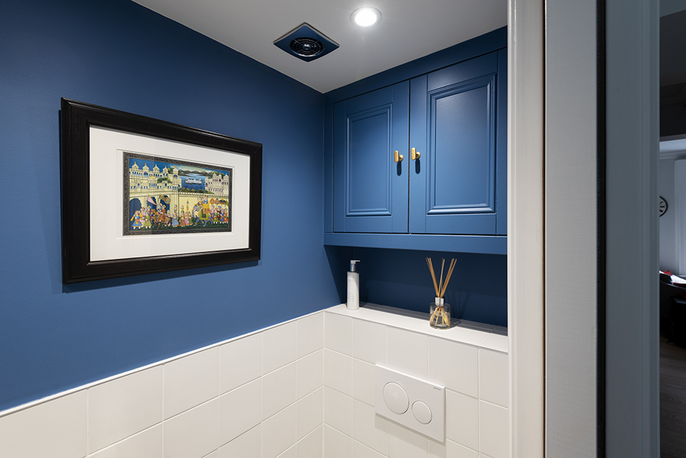 Built-in blue cupboard in alcove space