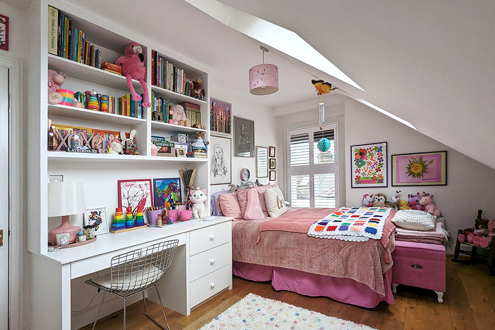 Fitted desk, drawers and shelving unit in child's bedroom. Built by carpenters at Bespoke Carpentry London