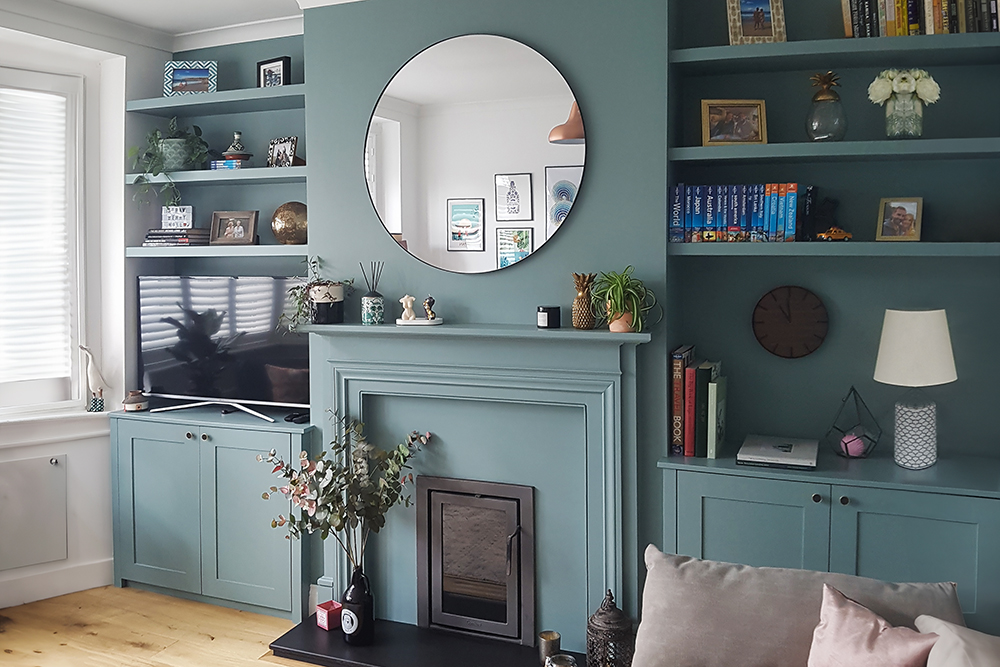 Green fitted alcove units in living room, made with MDF