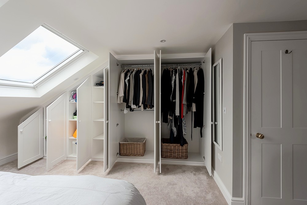 Inside fitted loft wardrobe
