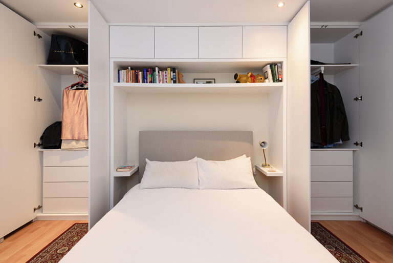Built-in over bed wardrobe in bedroom, made with MDF and hand-painted