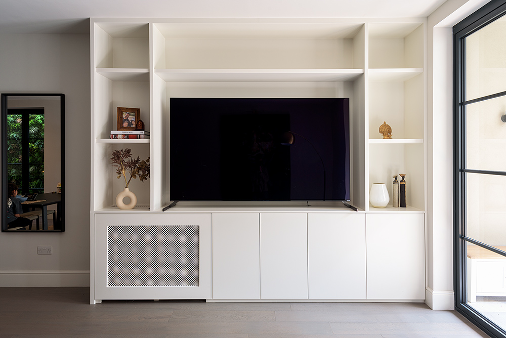 White fitted media unit in living room