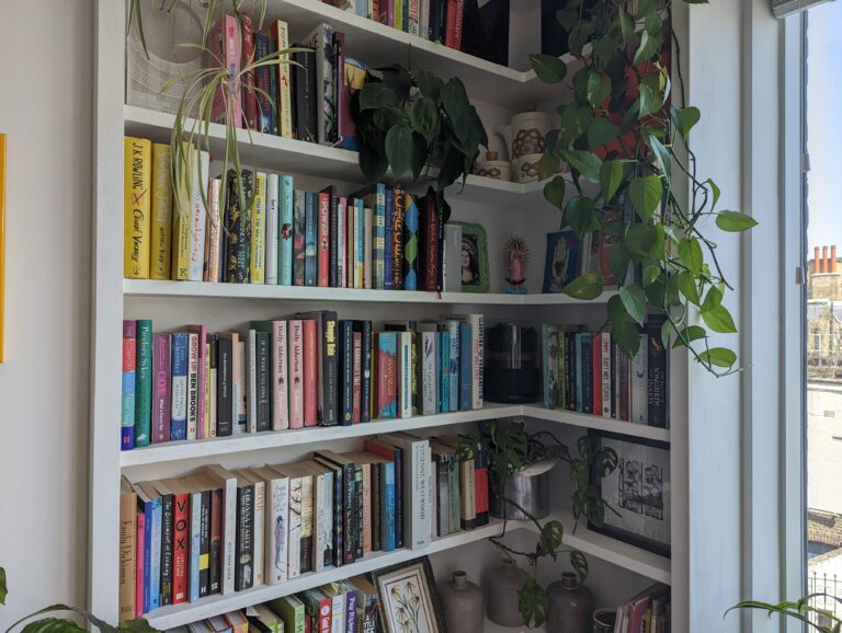 After picture of a transformation of a custom made corner alcove bookshelf.