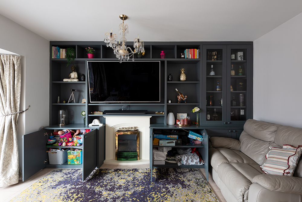 Wall to wall TV unit with storage cupboards