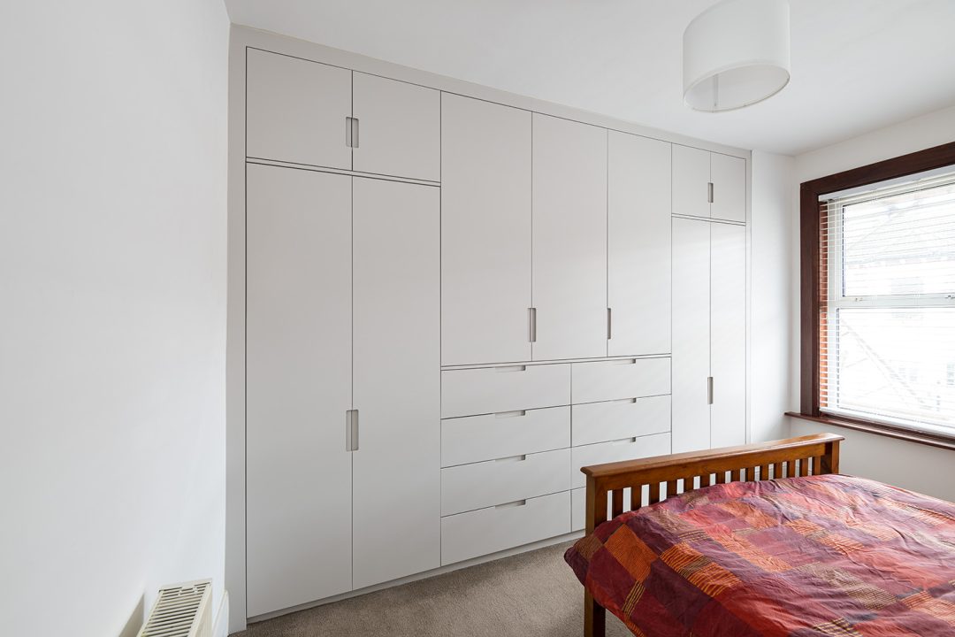 Bespoke wall to wall wardrobe with 4 doors and drawers