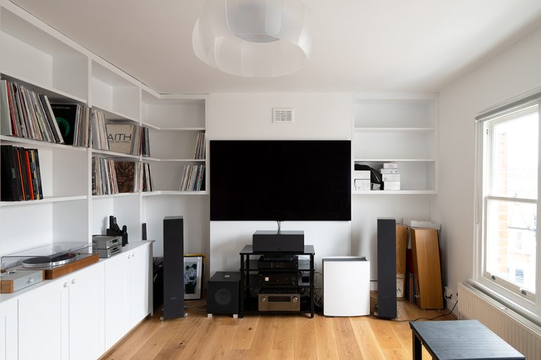 Built in cupboards and shelving to create a music and cinema room