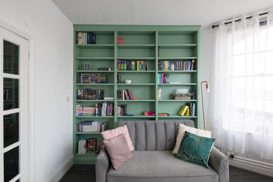 Wall to wall built in bookshelf and shelving unit.