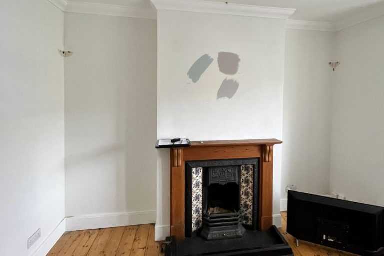 Before image of bare alcove spaces in living room