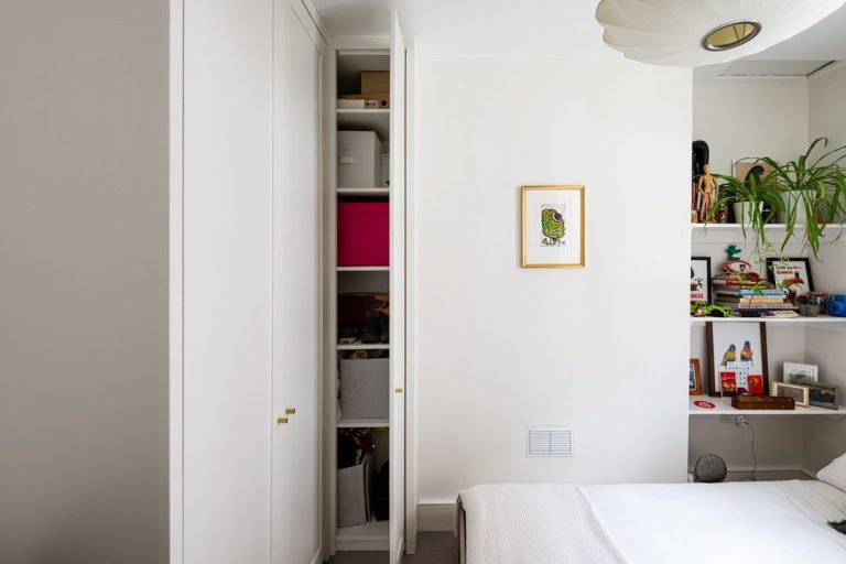 Bespoke corner wardrobe in bedroom