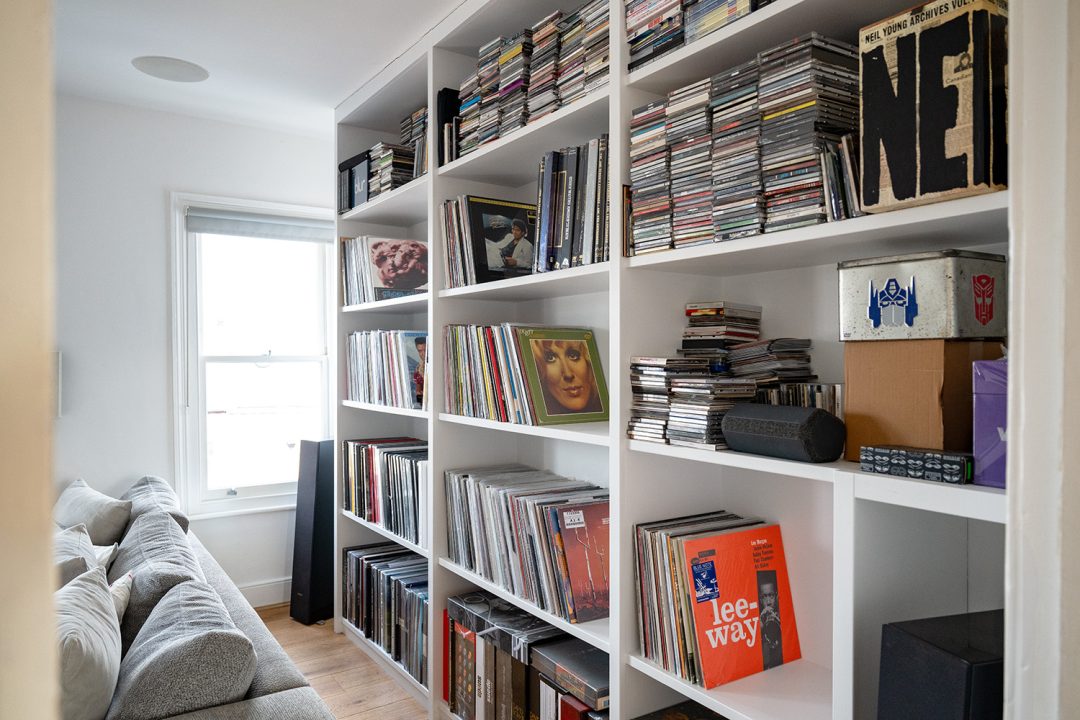 Built in shelving unit in living room to store vinyl records.