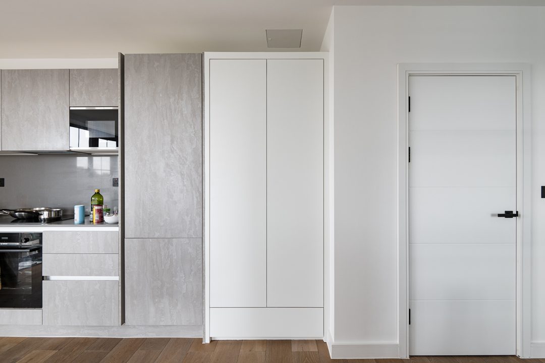 Built in kitchen wardrobe. Designed and installed by Bespoke Carpentry London.