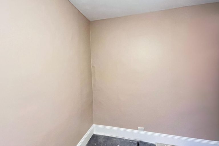 Before picture of empty wall in bedroom