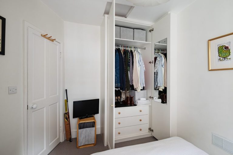 Bespoke wardrobe in corner of room with interview view