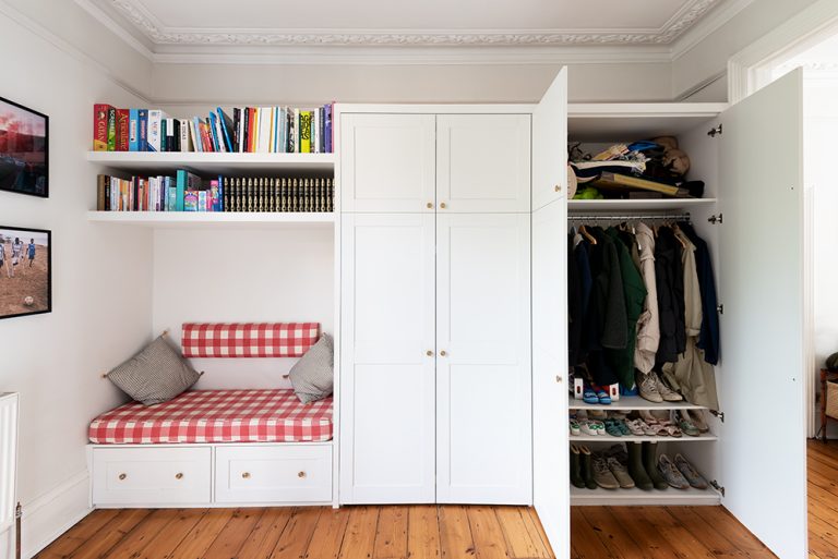 Bespoke wardrobe with multi functional purposes. Designed and installed by carpenters at Bespoke Carpentry London