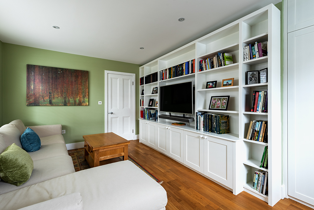Large built-in bookshelf with cupboards