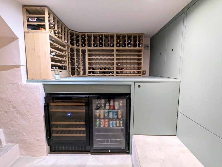 Built in storage cupboards and wine cellar in basement