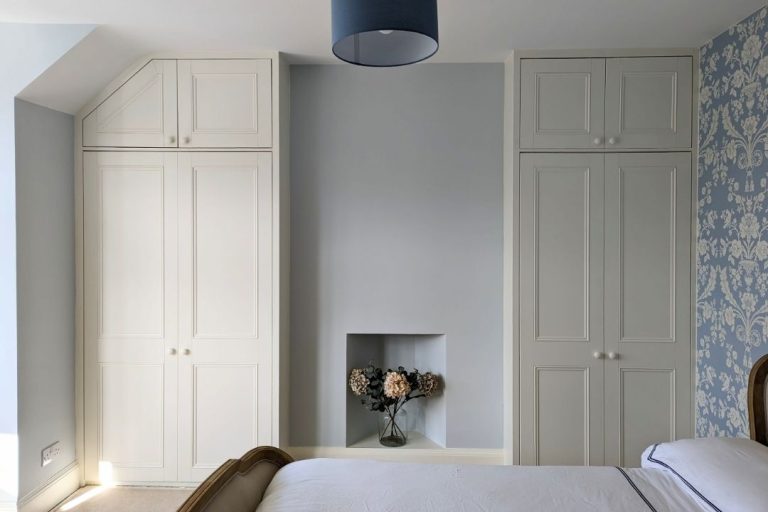 2 x sets of white alcove wardrobes. Designed and installed by Bespoke Carpentry London