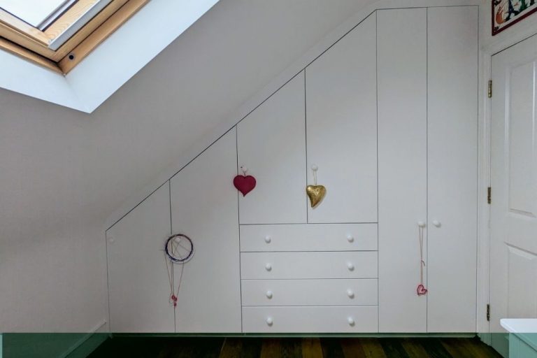 6 door loft wardrobe in kid's bedroom. Designed and installed by Bespoke Carpentry London