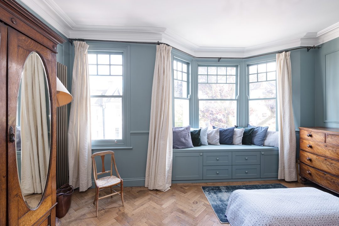 Bedroom with window seats for storag