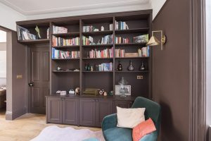 Built in brown shelving unit for books