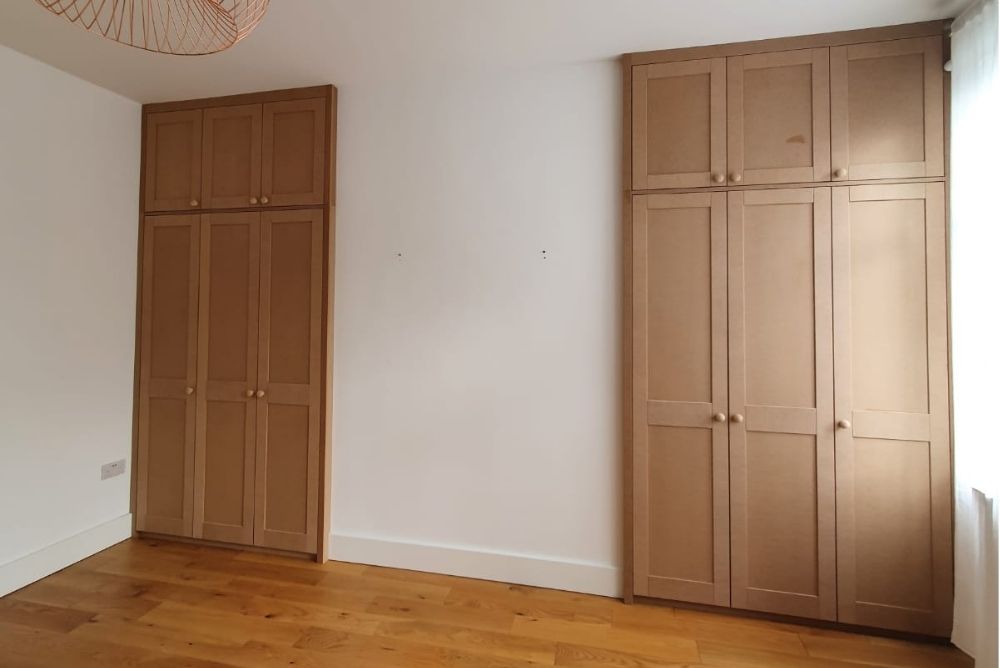 Two fitted alcove wardrobes in bedroom
