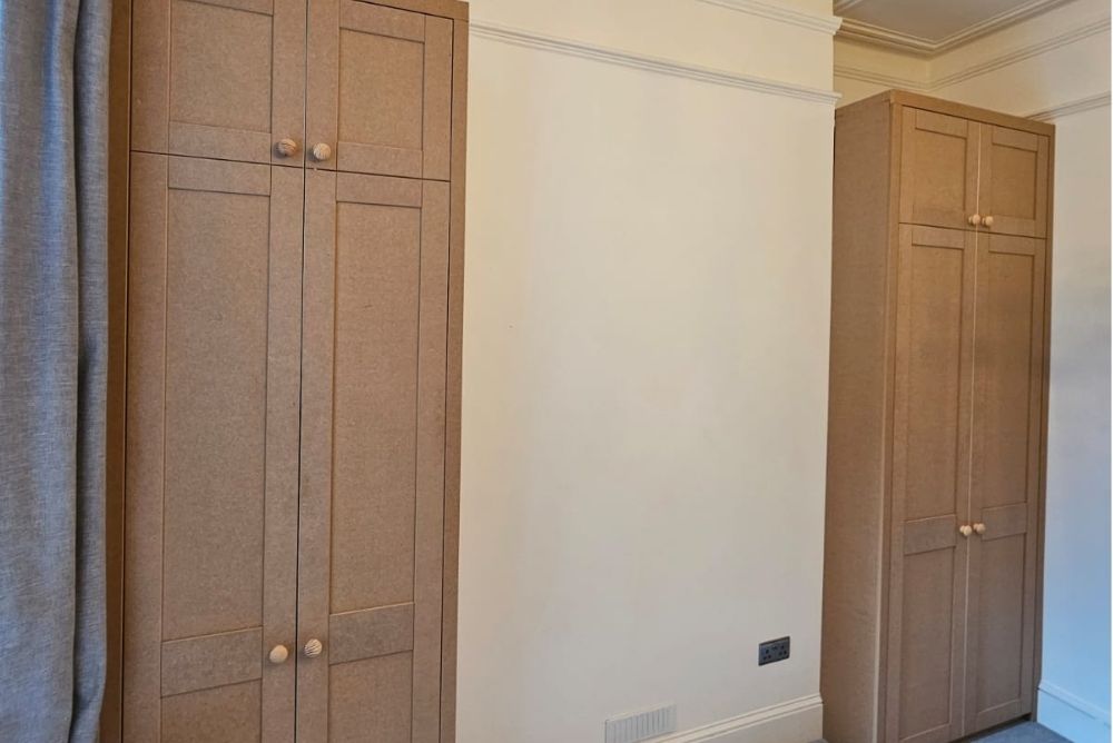 Two brown MDF fitted alcove wardrobes