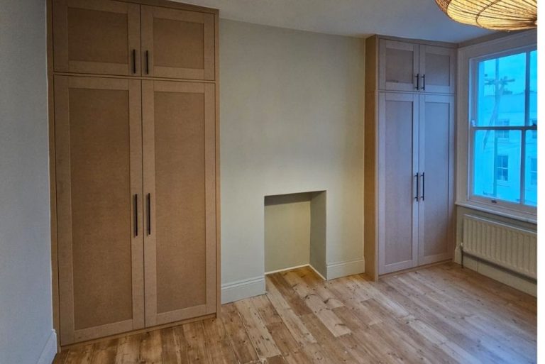 Two MDF fitted alcove wardrobe in bedroom