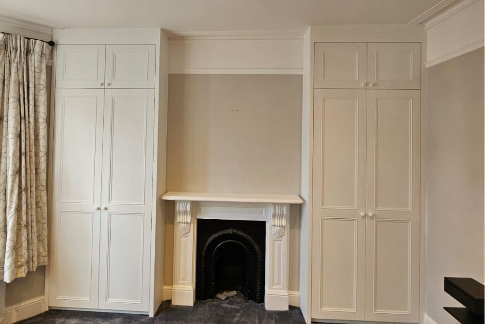 White chimney fitted alcove wardrobes next to chimney