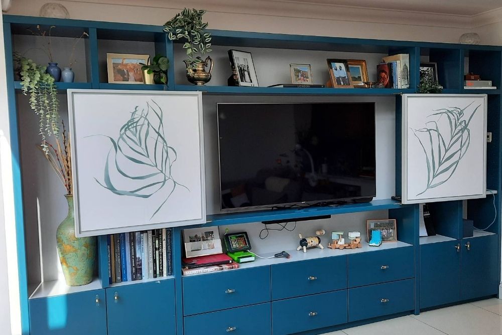 Blue built in TV unit with cupboards