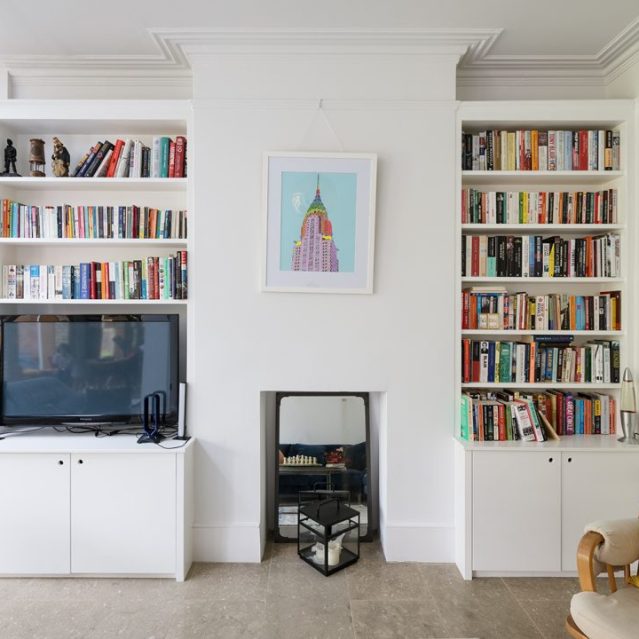Built-in alcove shelving with many books