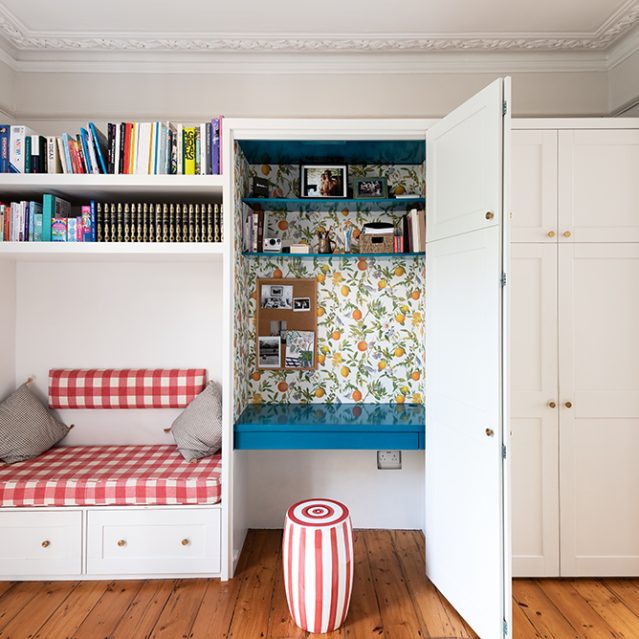Built-in multifunctional wardrobe with desk, seating area and bookcase. Designed and installed by Bespoke Carpentry London.