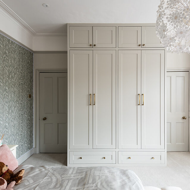 Fitted 4 door modern wardrobe. Designed and installed by carpenters at Bespoke Carpentry London.